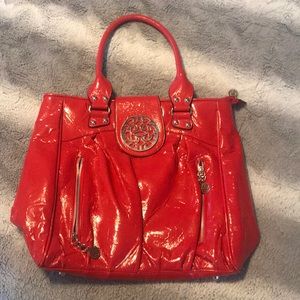Red Steve Madden should bag with front zip pockets